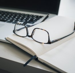computer glasses and pen