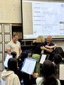 Henry Miller and Cassie Parham hug in classroom